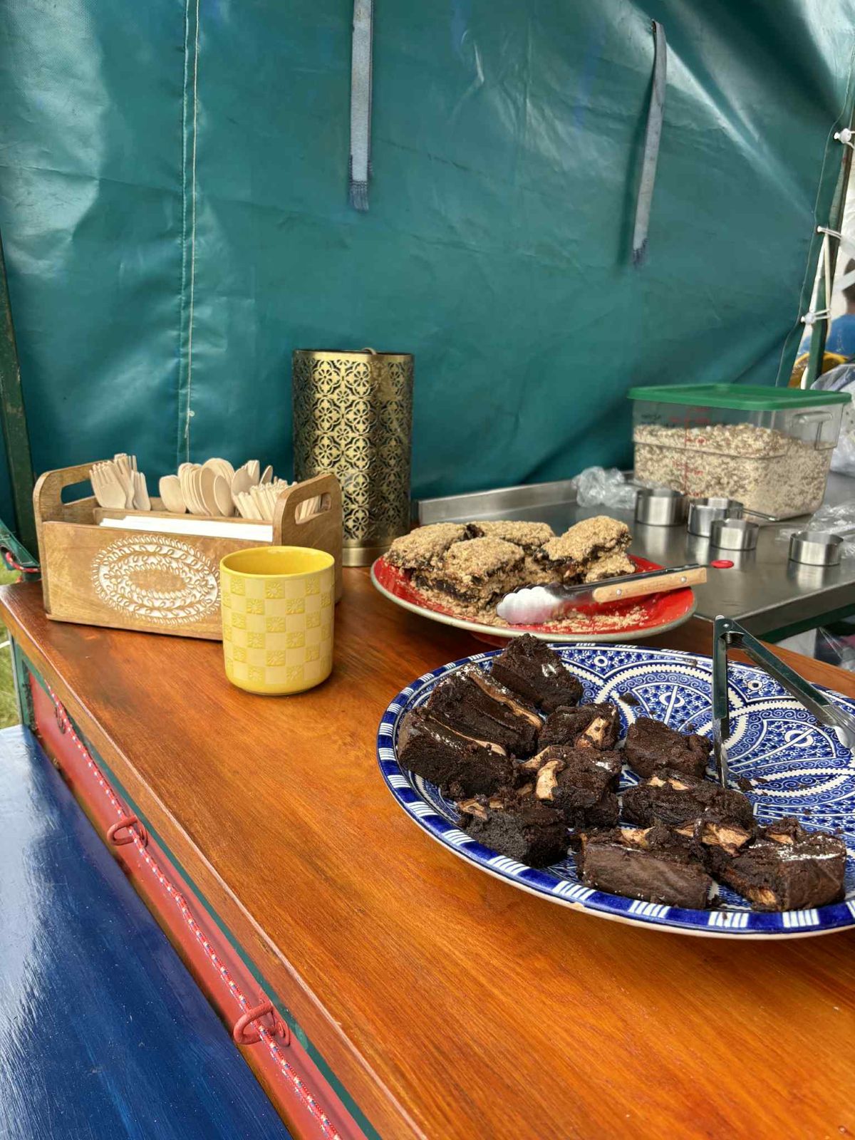 Homemade date and apricot slice, and chocolate, pear and cardamom cake, on patterned plates